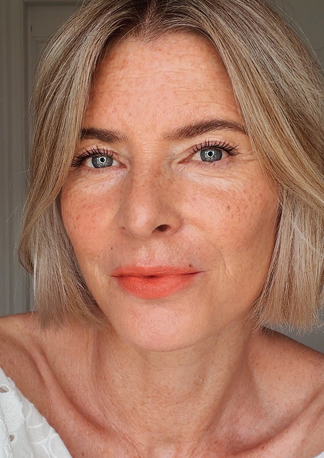 Blushing Coral — luminous coral lipstick, AndBloom