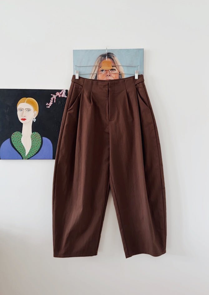 AndBloom - Sienna Rose - Brown Trousers - Hanging at wall