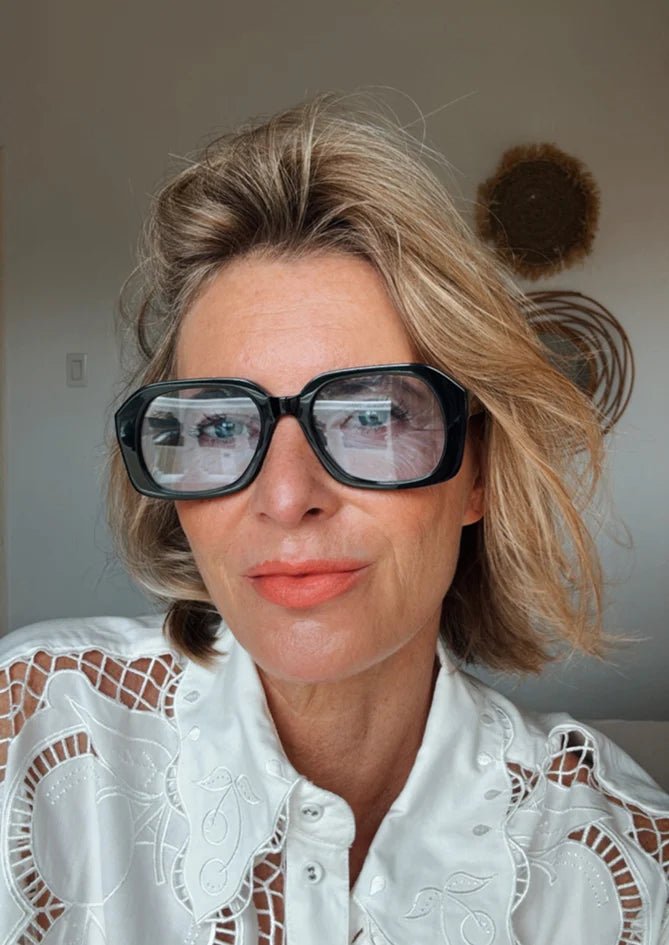 Lilium sunglasses – AndBloom eyewear worn with striped blouse indoor
