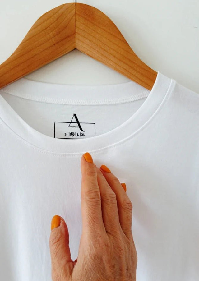 Close-up of The Classic White T-shirt – AndBloom with accessories